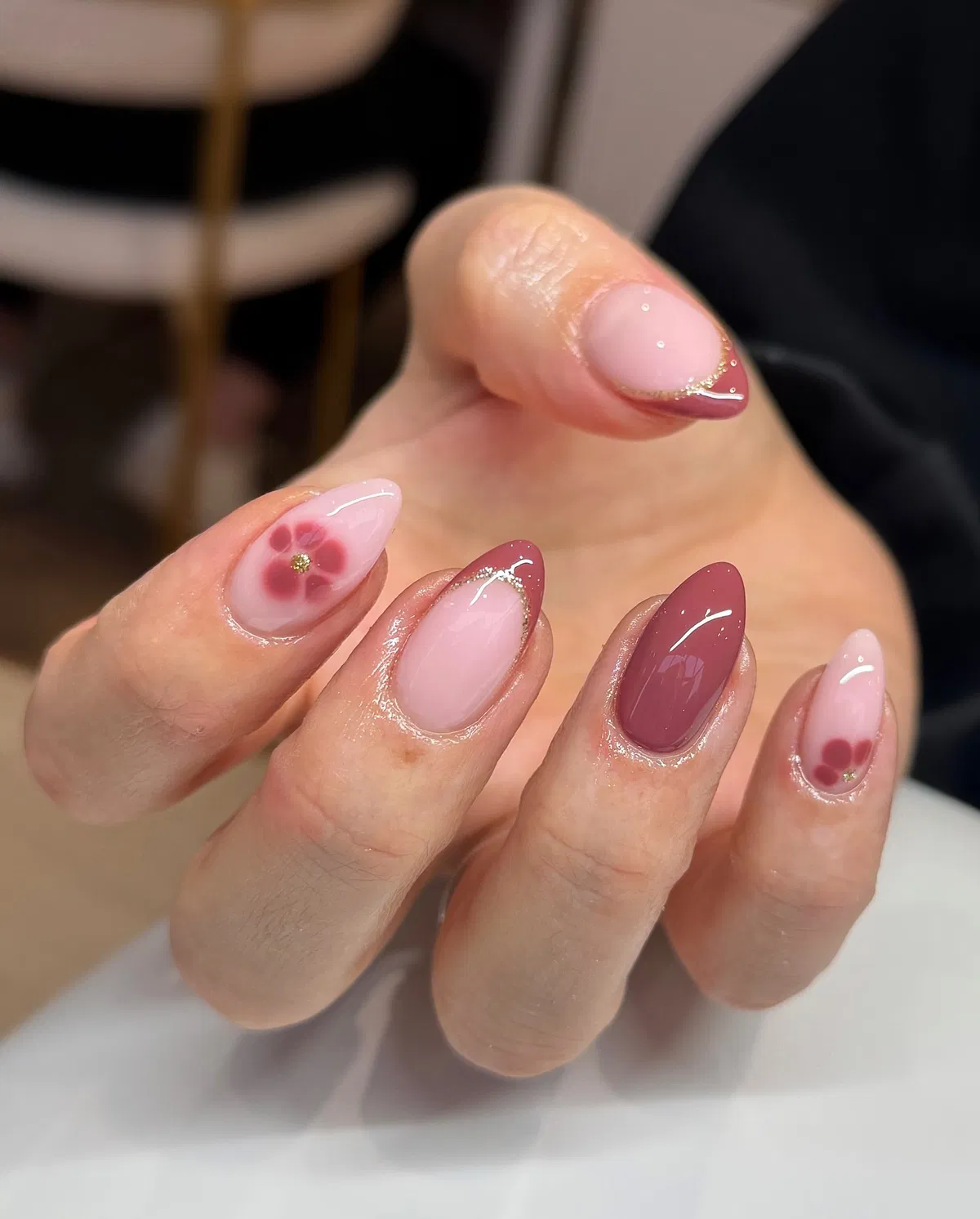 Mauve French tips with thin gold edging and florals