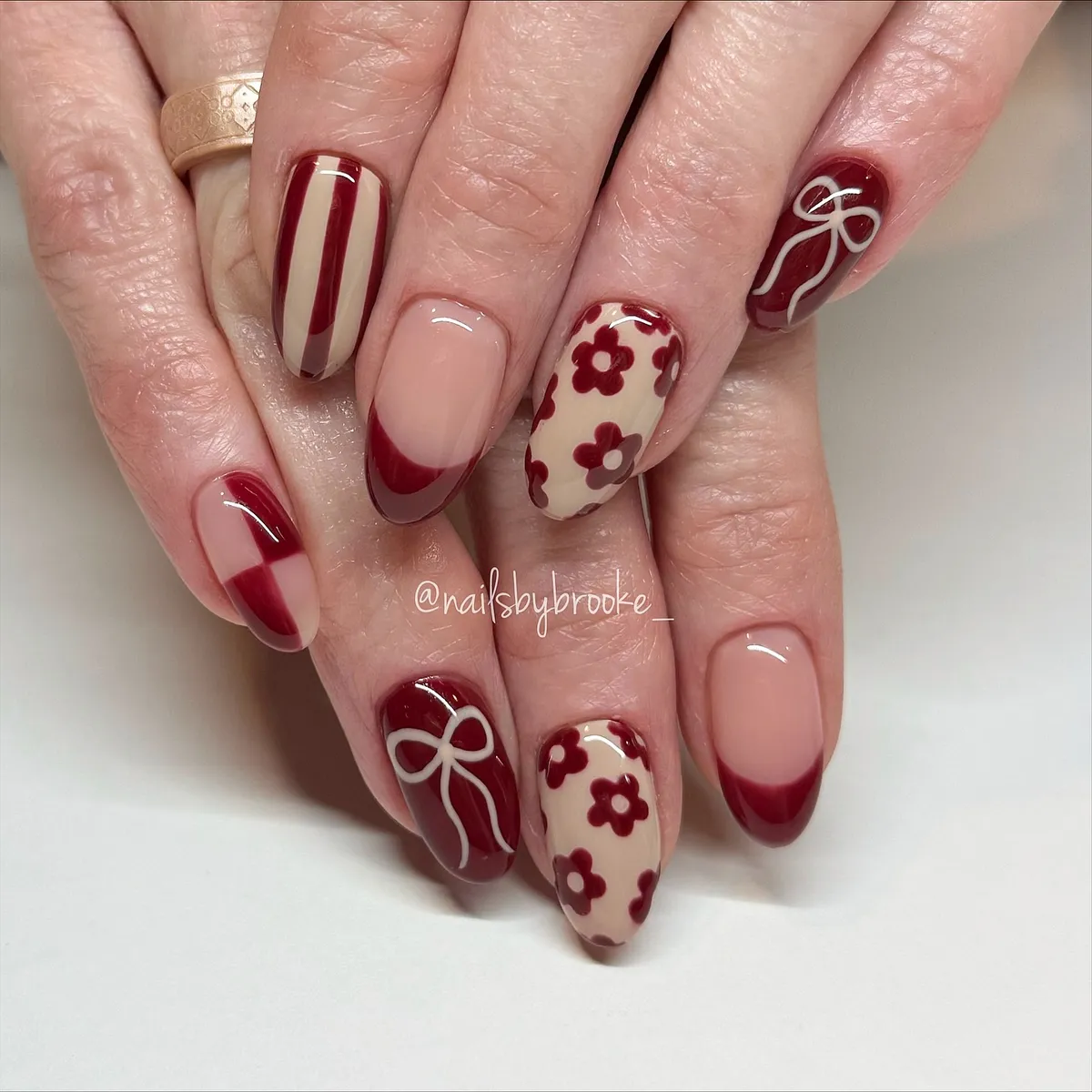 Burgundy French tips with florals and bows