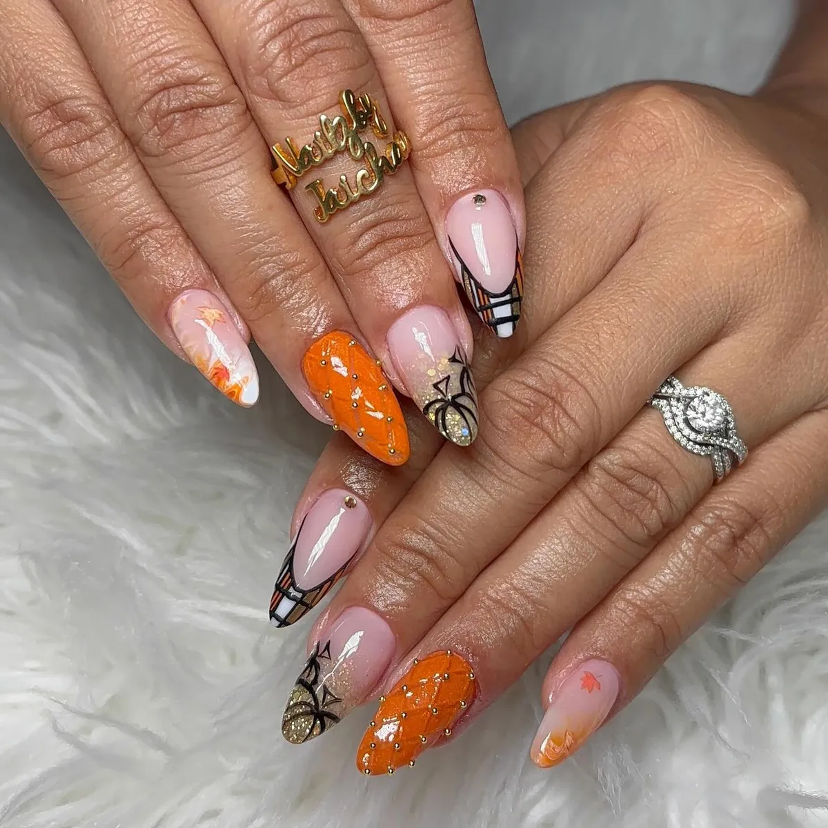 Orange and plaid French tips with gold accents