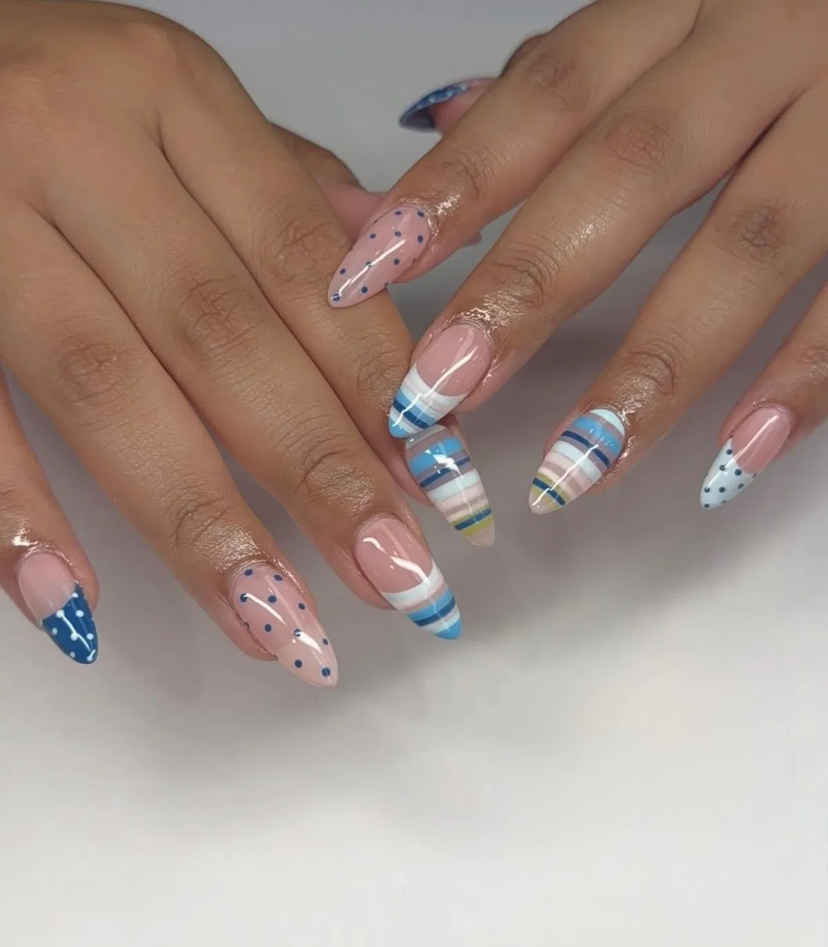 Blue striped French tips with polka dots
