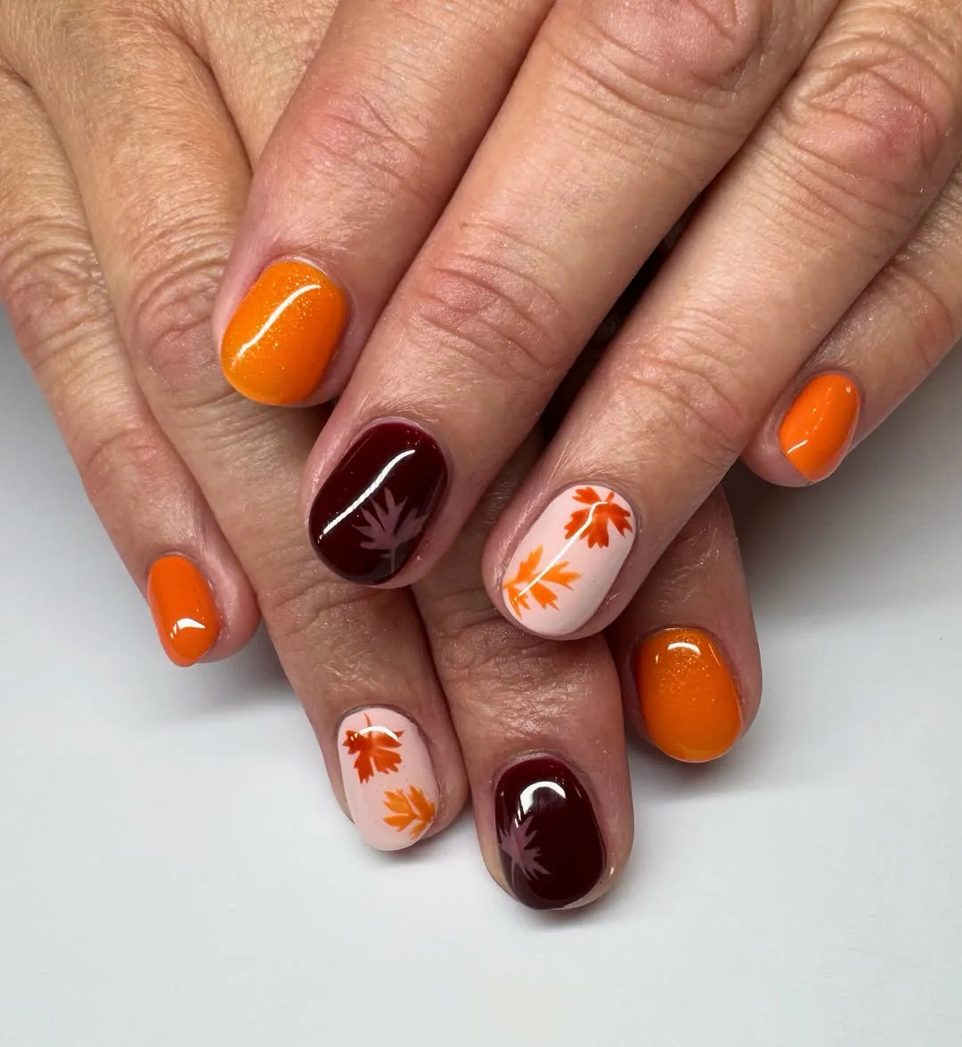 Orange & Burgundy with Leaf Silhouette Accents