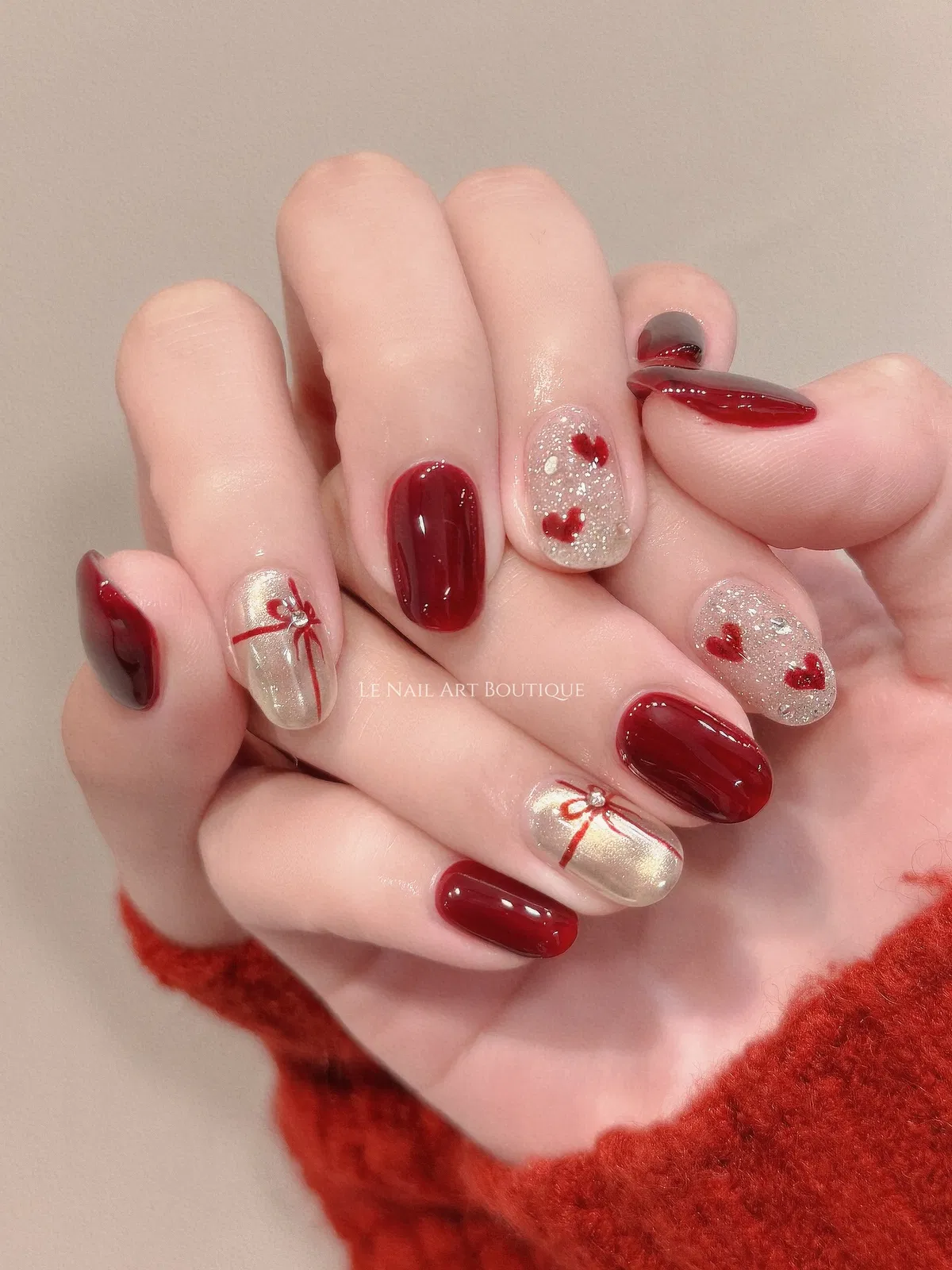 Deep red with heart-glitter accents and ribbon designs