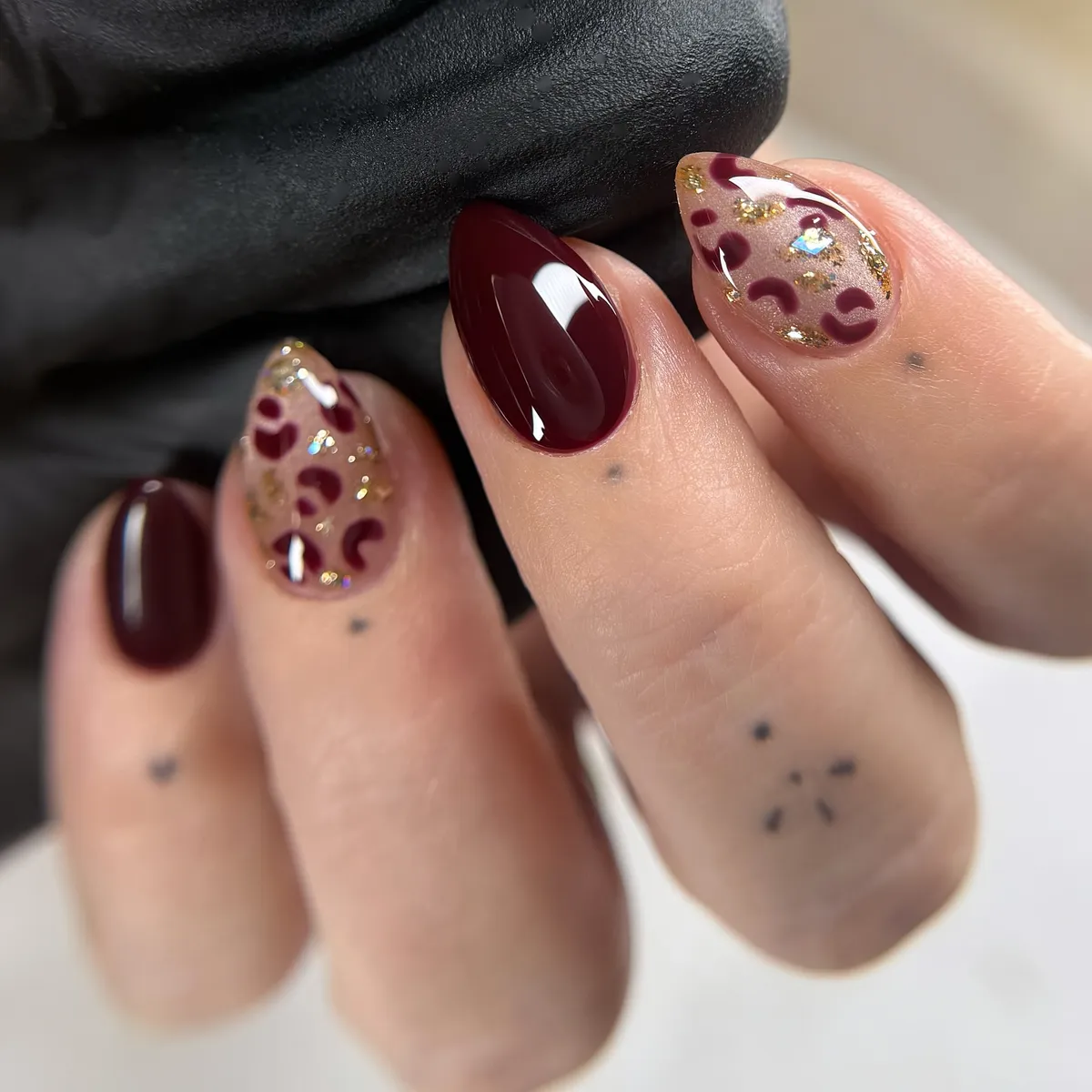 Burgundy solid and spot accents with gold flakes