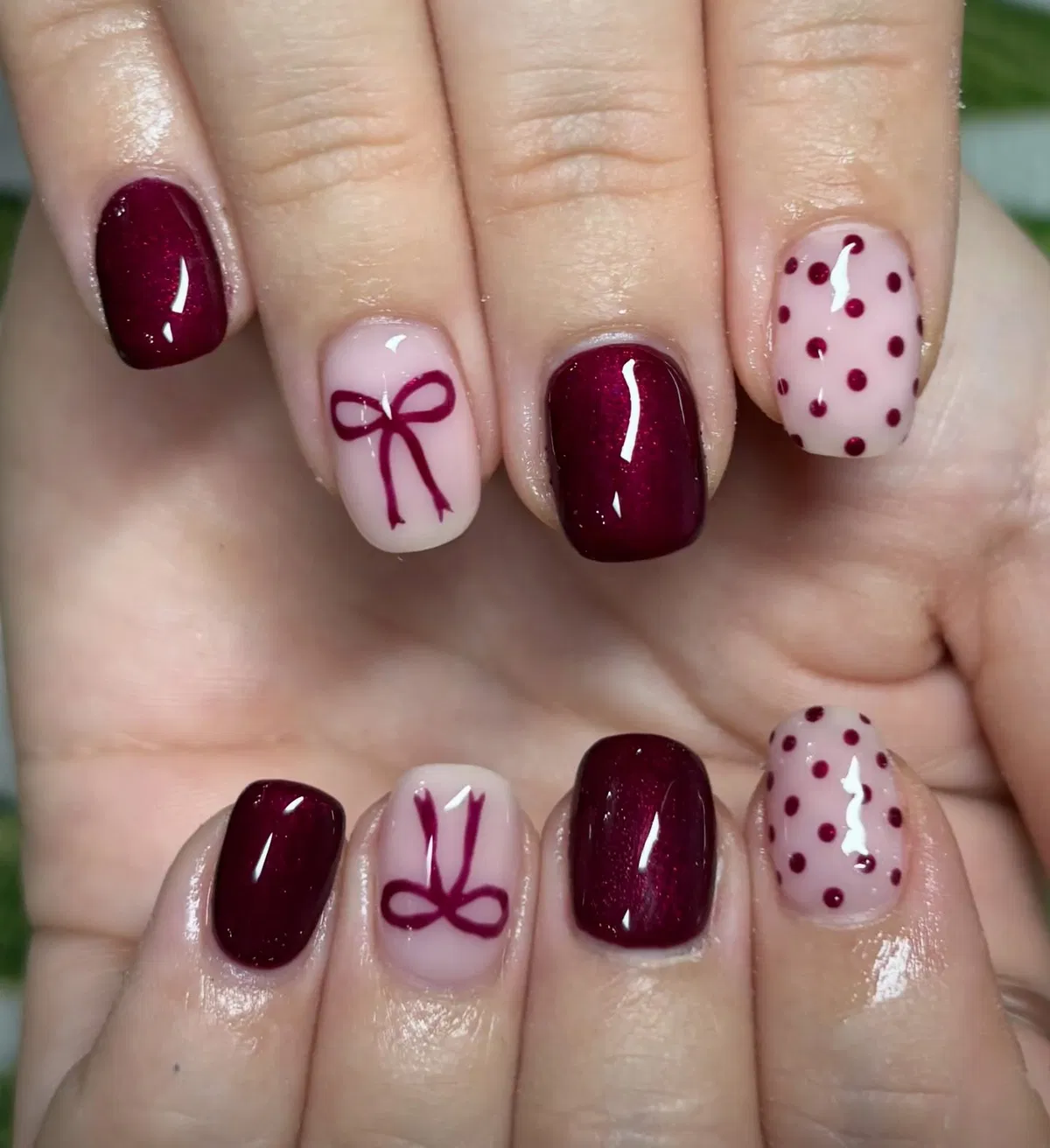 Burgundy shimmer with bow and polka-dot accents