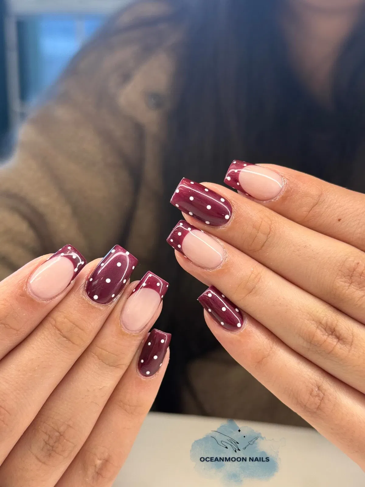 Burgundy and nude square nails with white polka dots