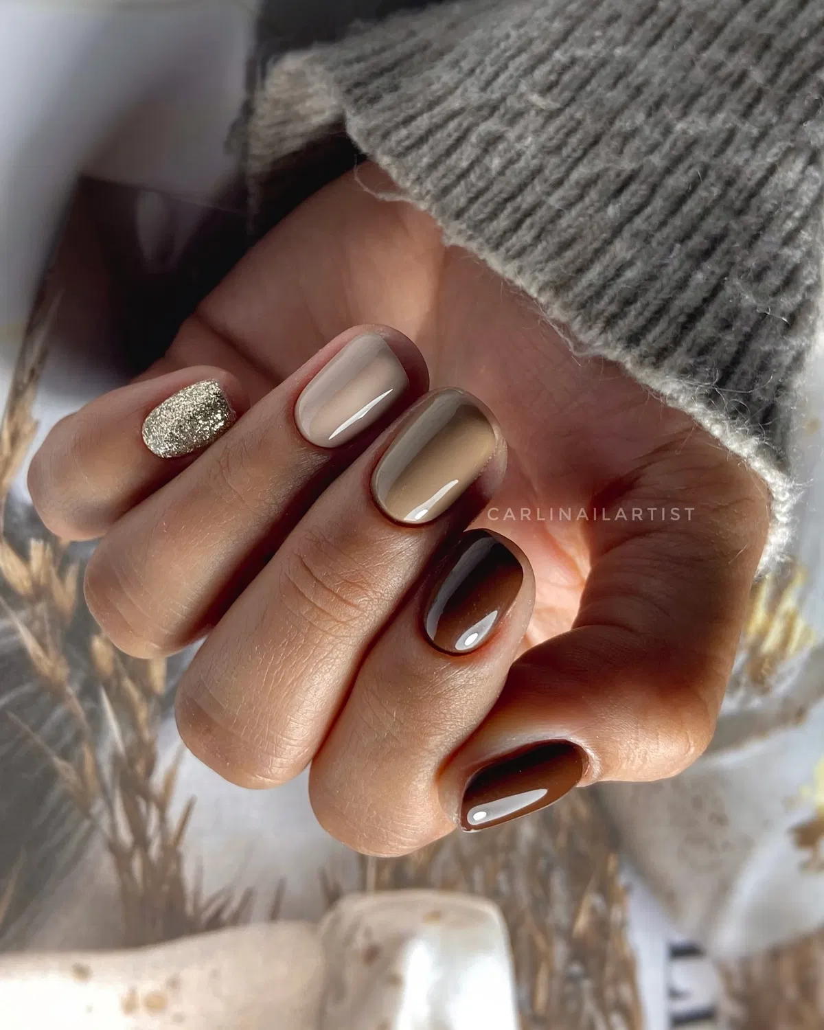 Neutral-to-brown ombre squares with a silver glitter accent