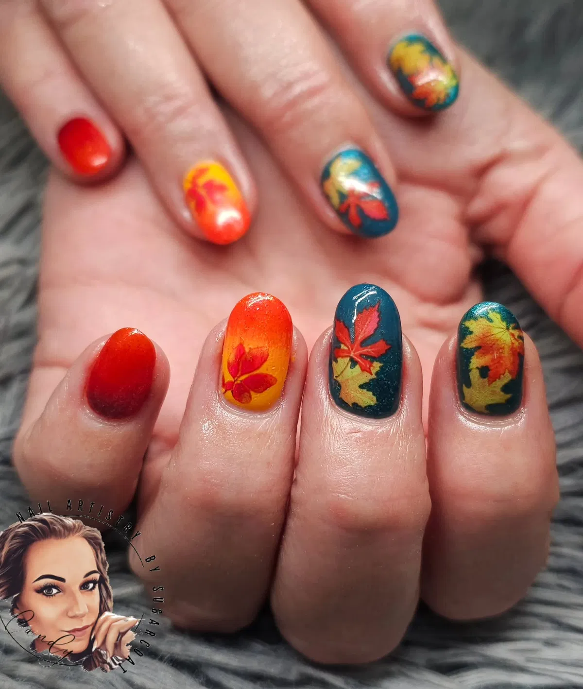 Red gradients and teal nails with multicolor leaf art