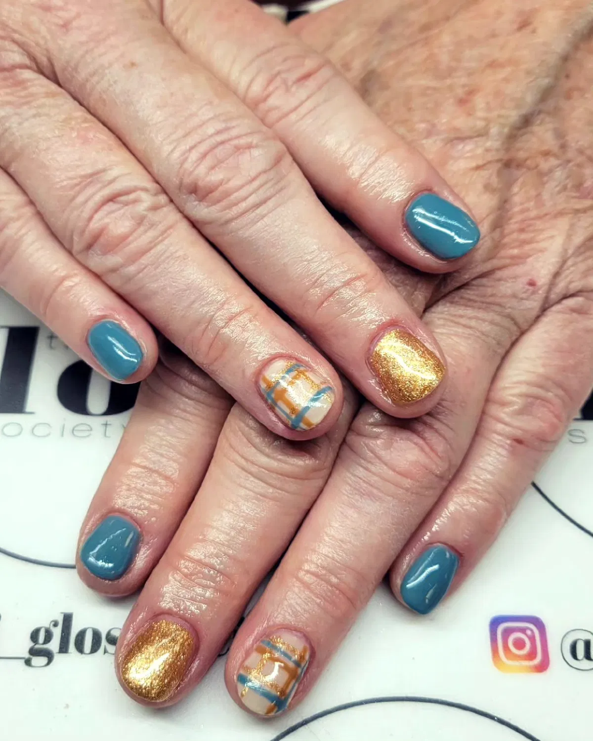 Muted teal-blue with gold glitter and plaid accent