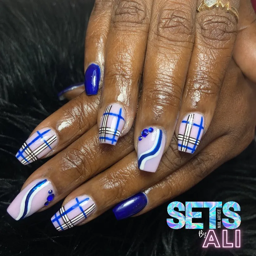 Blue plaid and wavy stripe accents on pale pink base