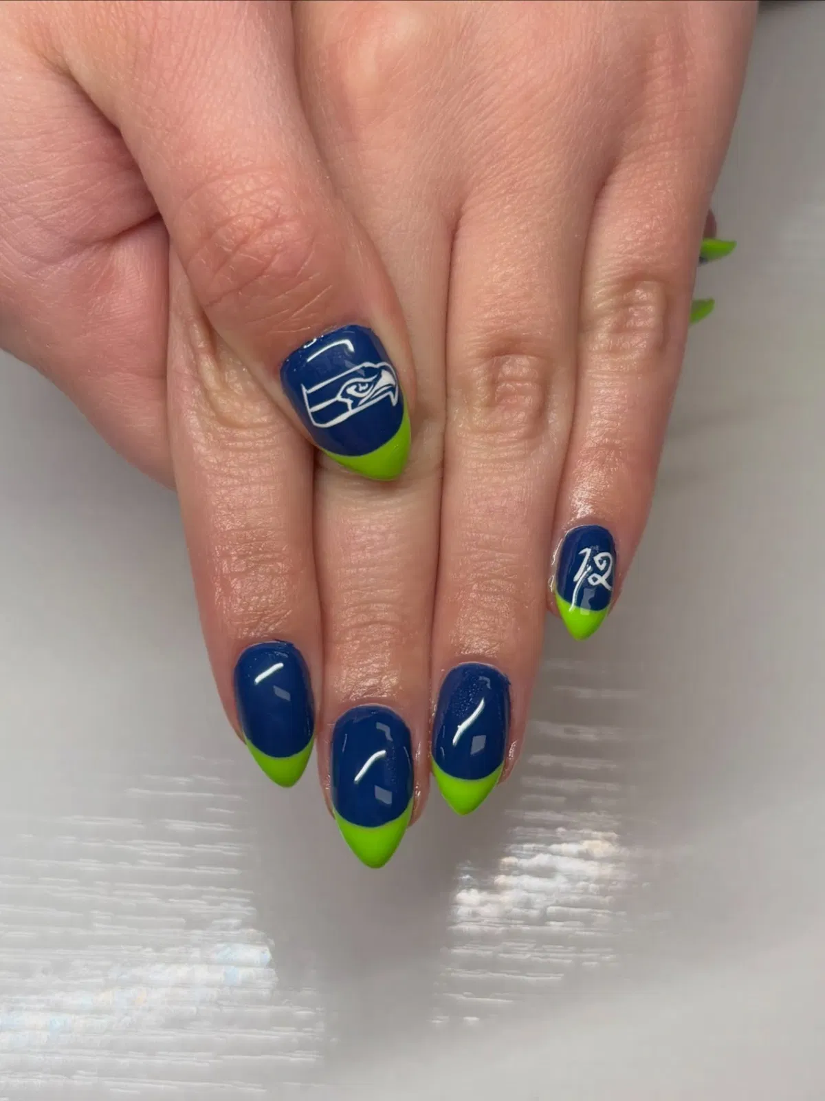 Dark blue and neon green tips with white graphic details