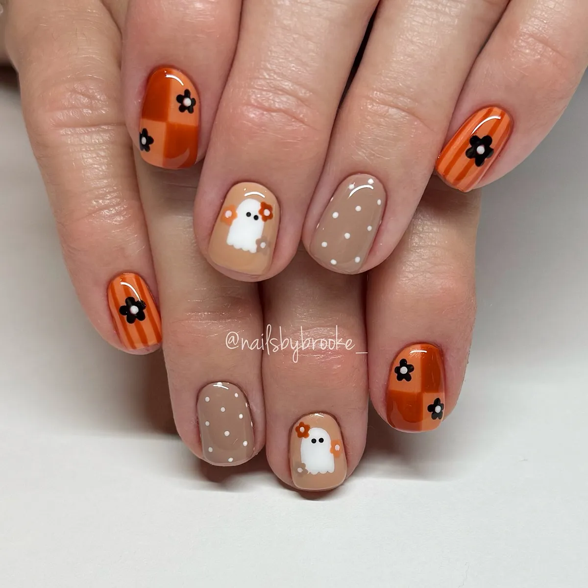 Orange florals with polka dots and a small ghost figure