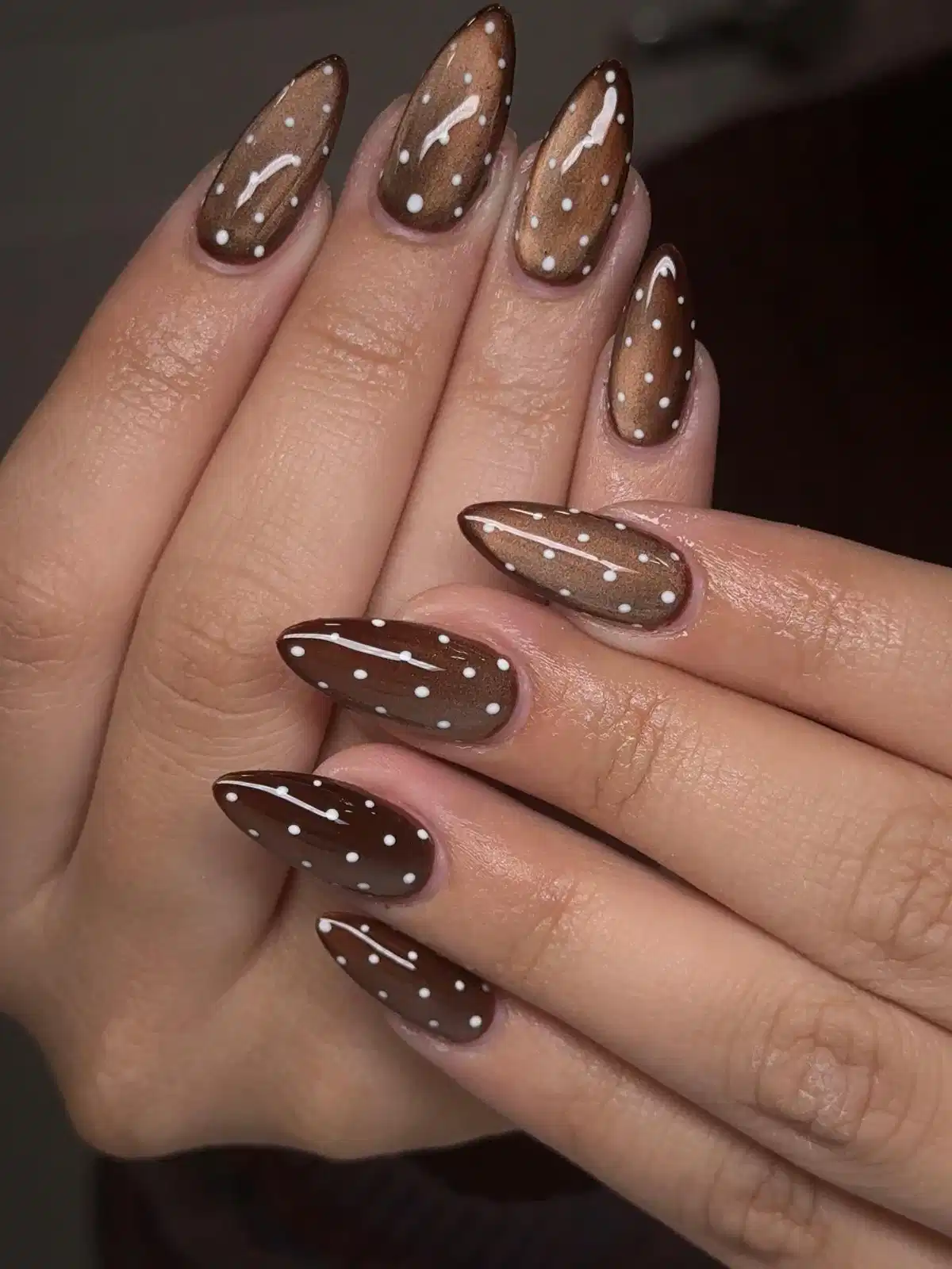 Brown metallic nails with white polka dots