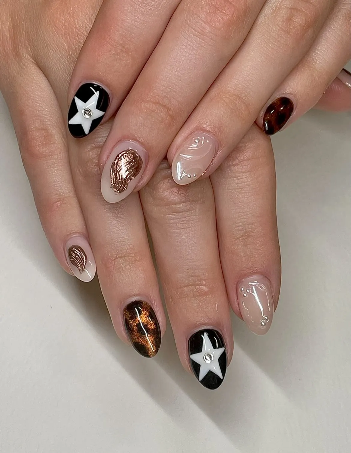 Mixed set: stars, raised clear swirls, and copper accents