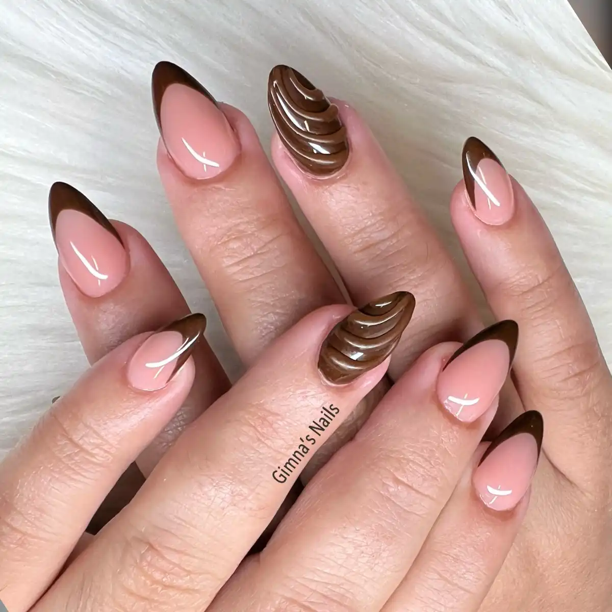 Dark brown French tips with raised wavy brown accents