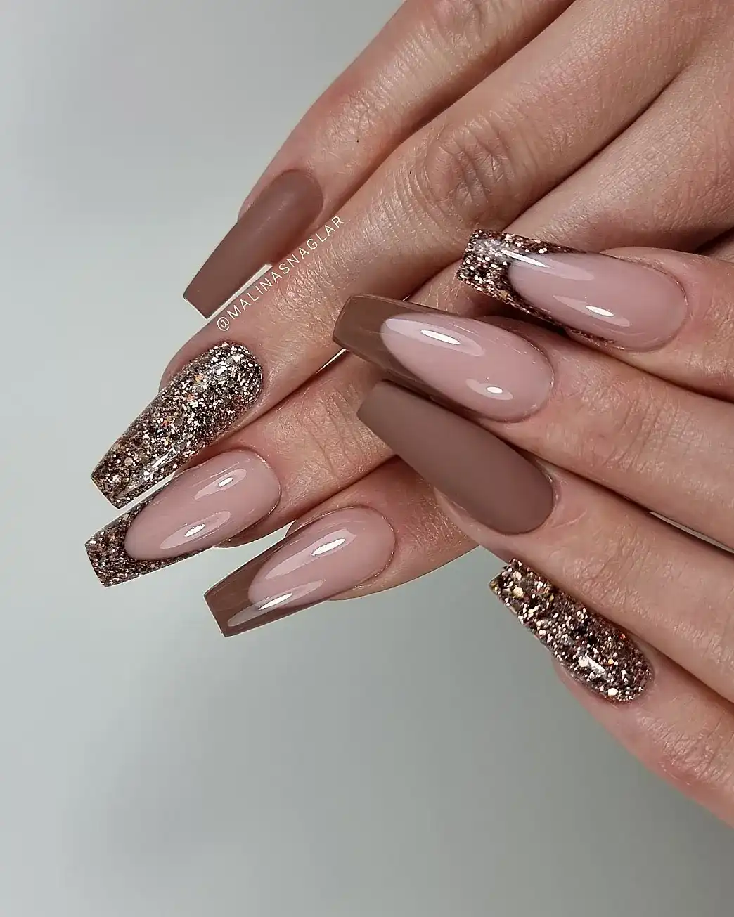 Coffin nails with brown French tips and glitter accents