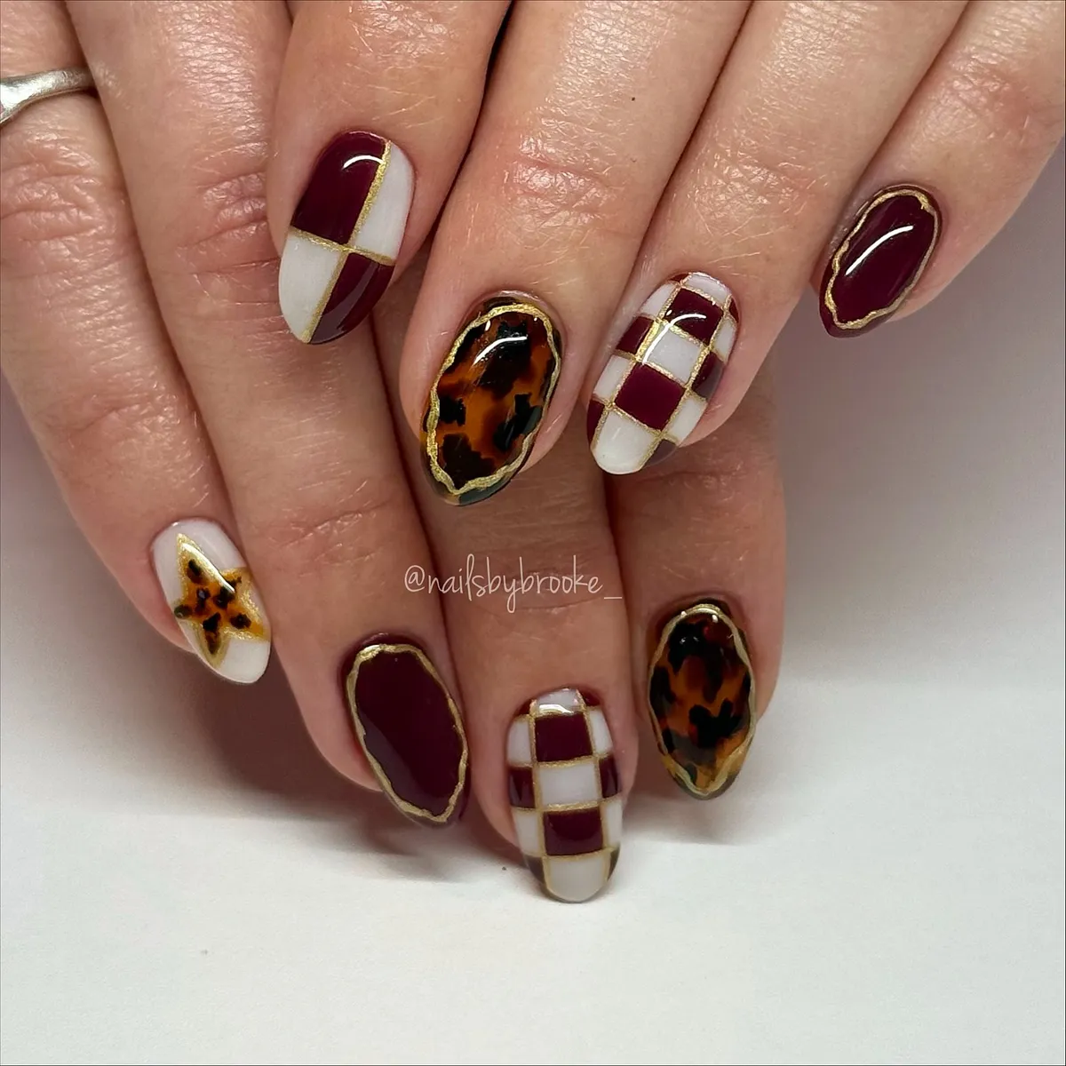 Burgundy-brown and white with gold grid accents