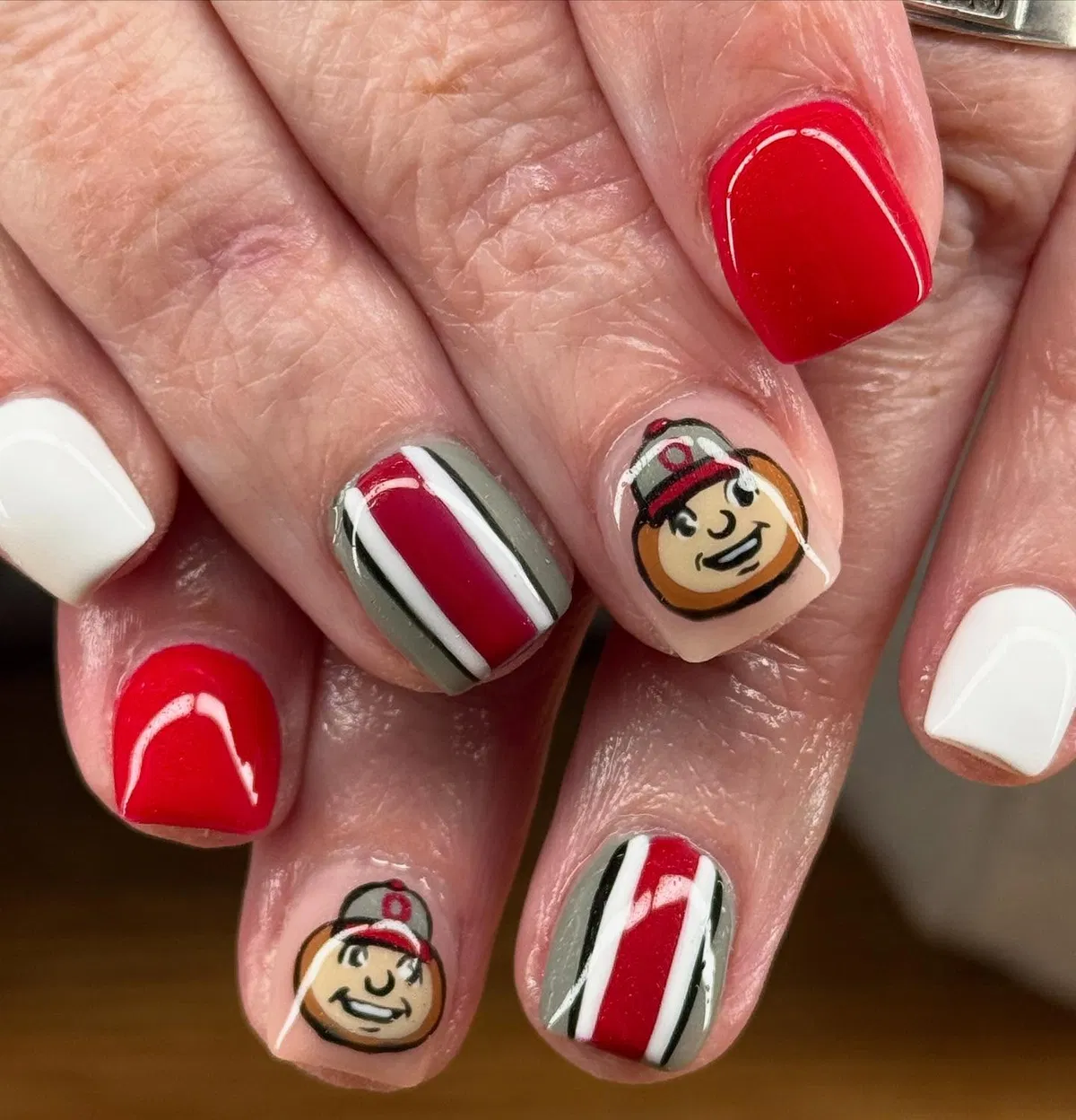 Red, white, and gray stripes with cartoon face accents