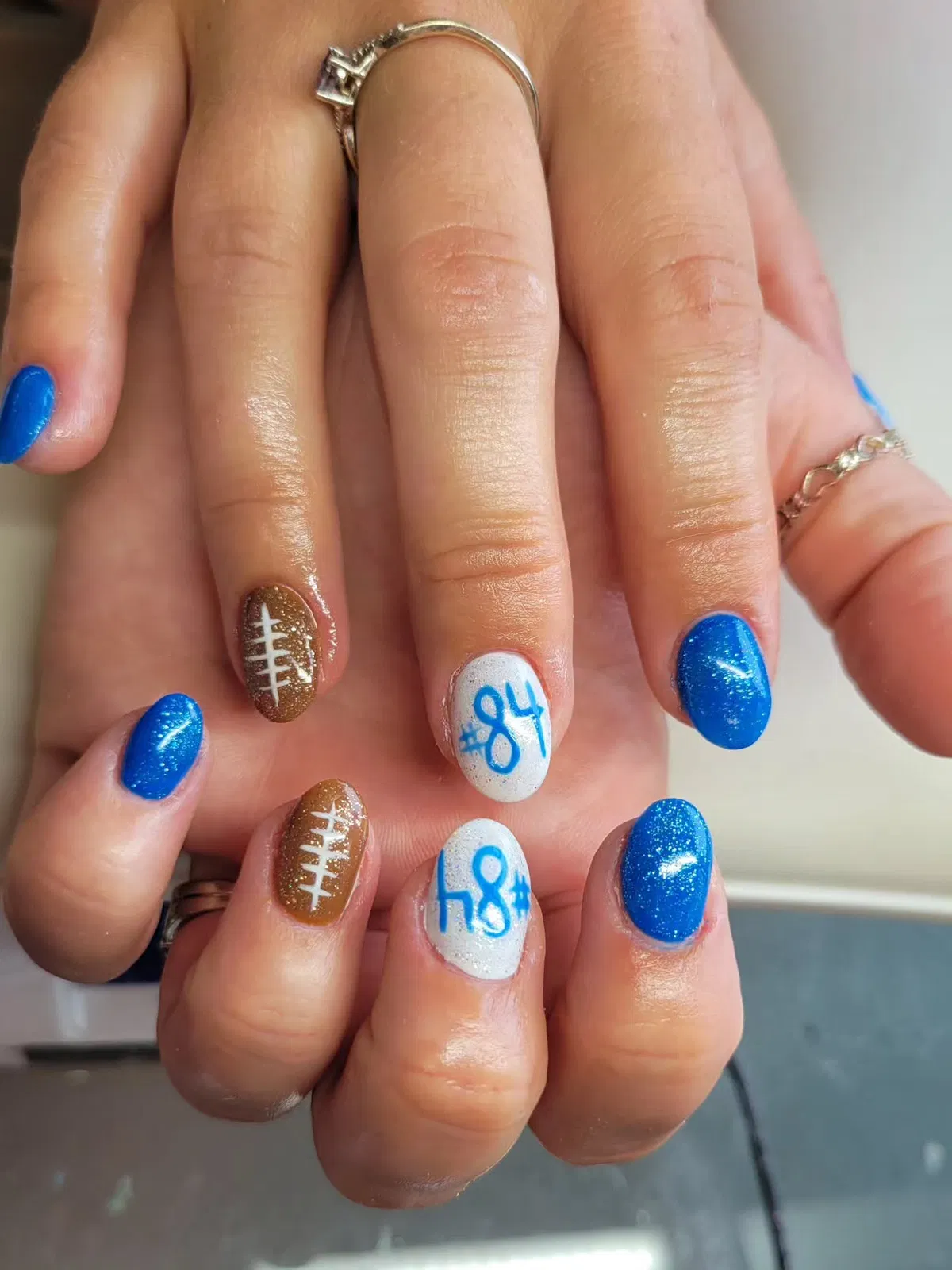 Blue glitter with football laces and blue numbers