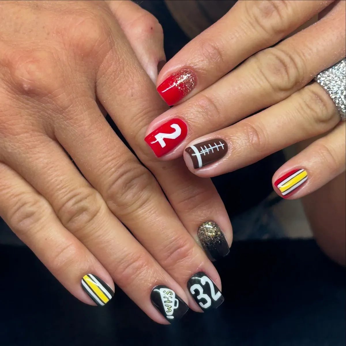 Red, black, and brown football-number mix