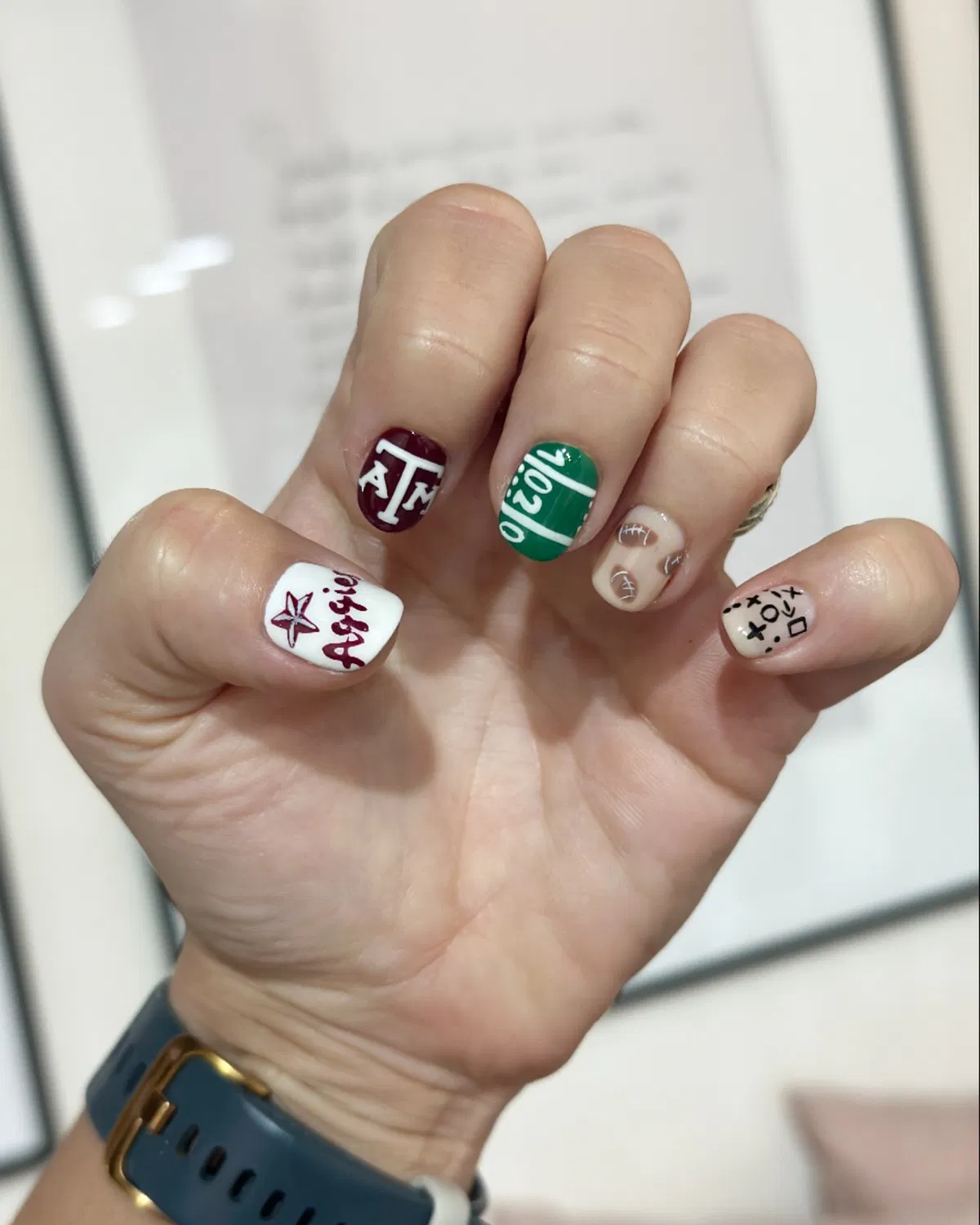 Maroon lettering with green field “10” and play symbols