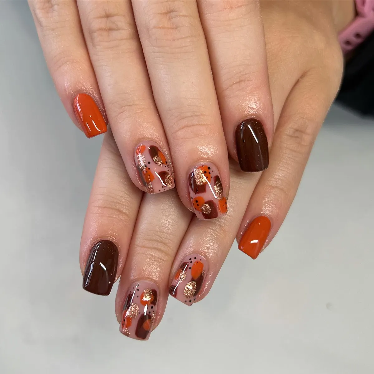 Orange and deep brown solids with abstract dotted accents