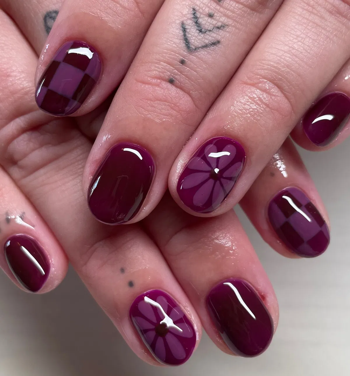 Glossy plum with checkerboard and flower motifs