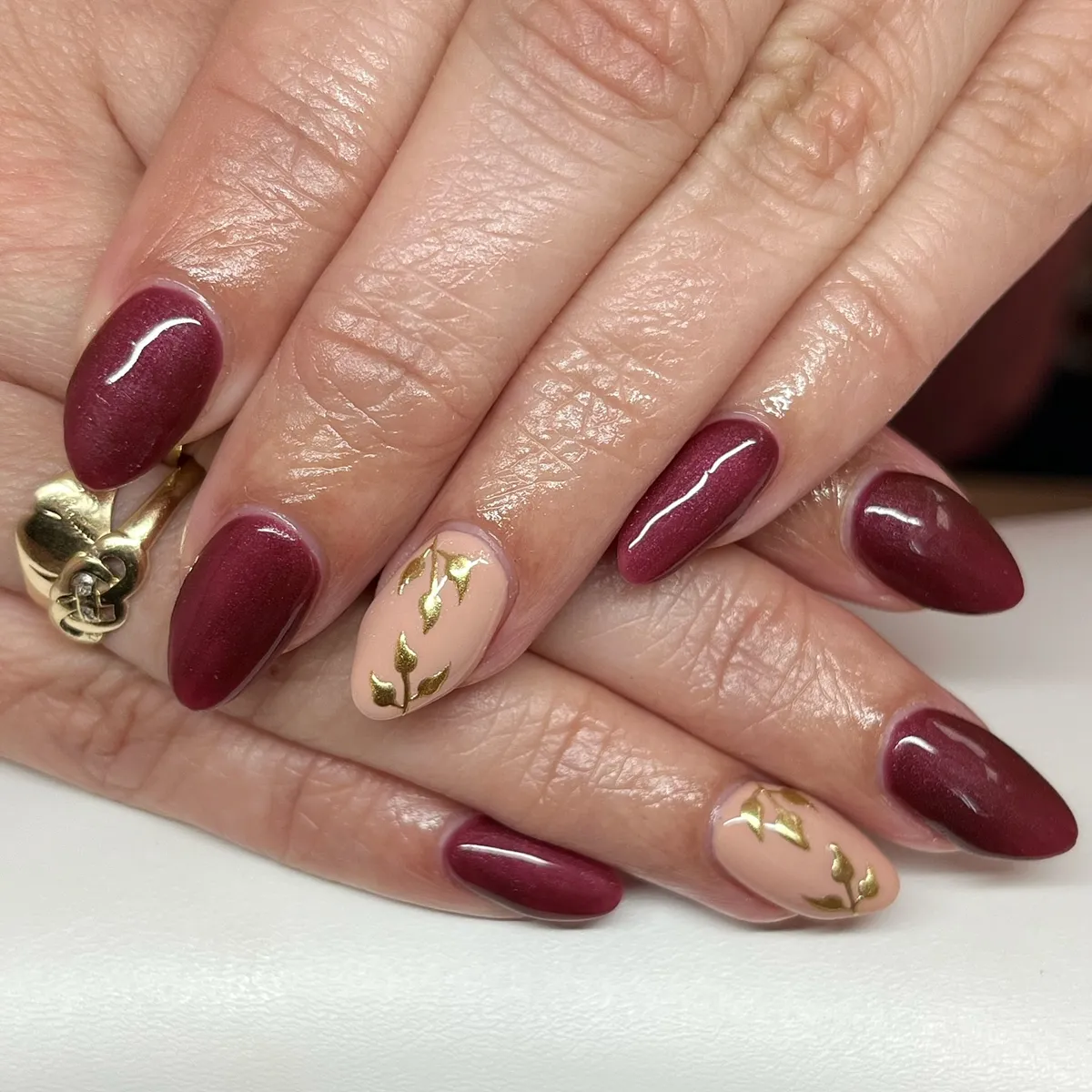 Shimmery plum with nude-and-gold leaf accents