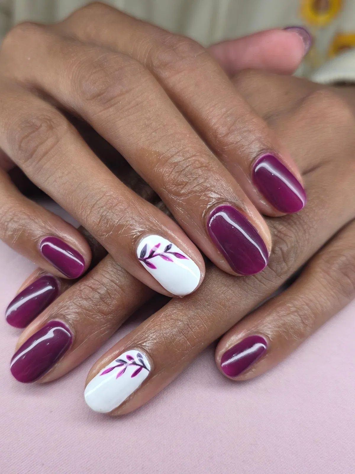 Glossy dark plum with white leaf accents