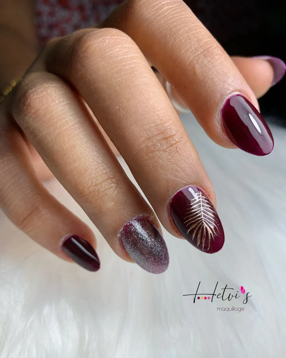 Plum almond nails with fern motif and silver accent