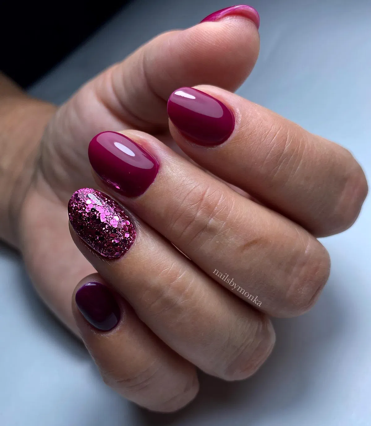 Glossy plum with chunky pink glitter accent