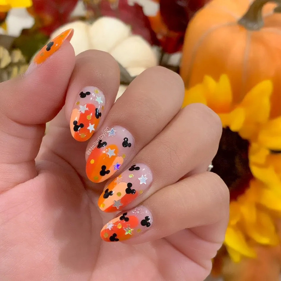 Orange Ombrรฉ Confetti with Mouse-Head Silhouettes