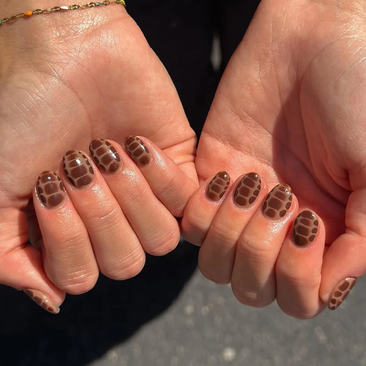Brown Spotted Pattern Across All Nails