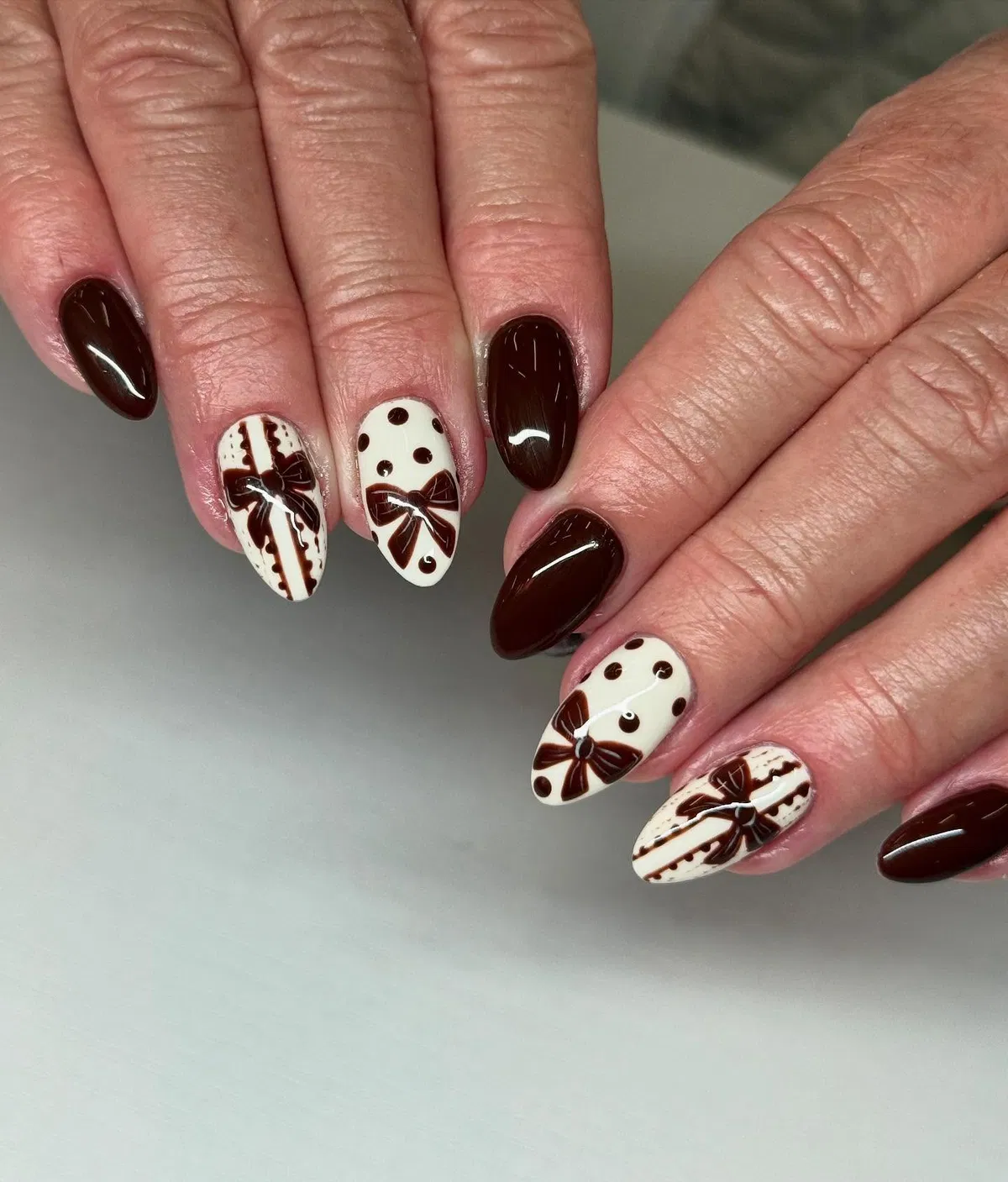 Dark brown solids with cream bow-and-polka-dot accents