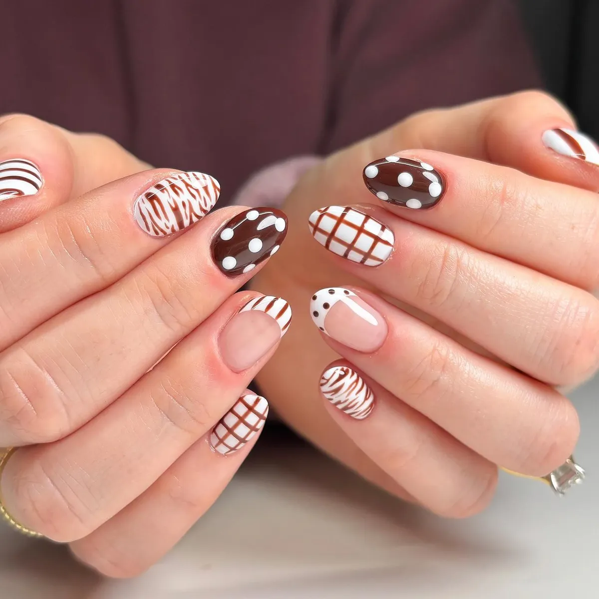 Brown-and-white mix: polka dots, grid, and wavy stripes