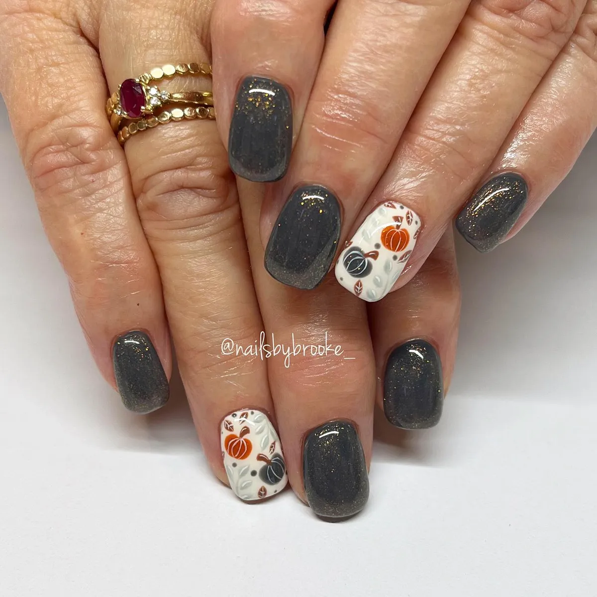 Charcoal shimmer with white pumpkin accent nails