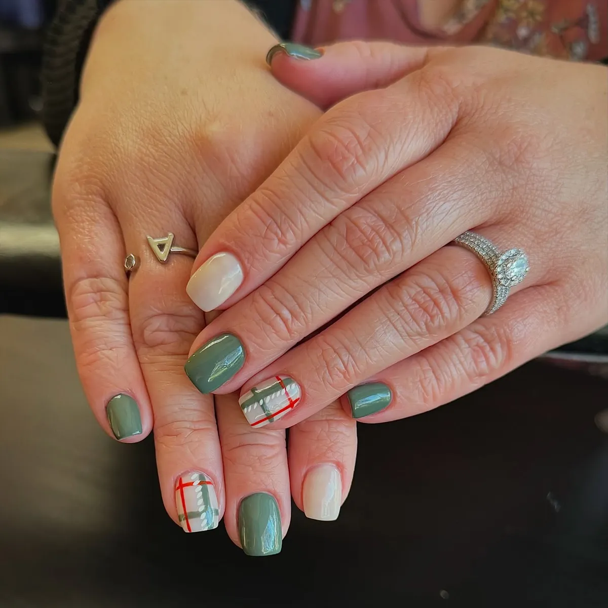 Sage green and off-white with red-green plaid accents