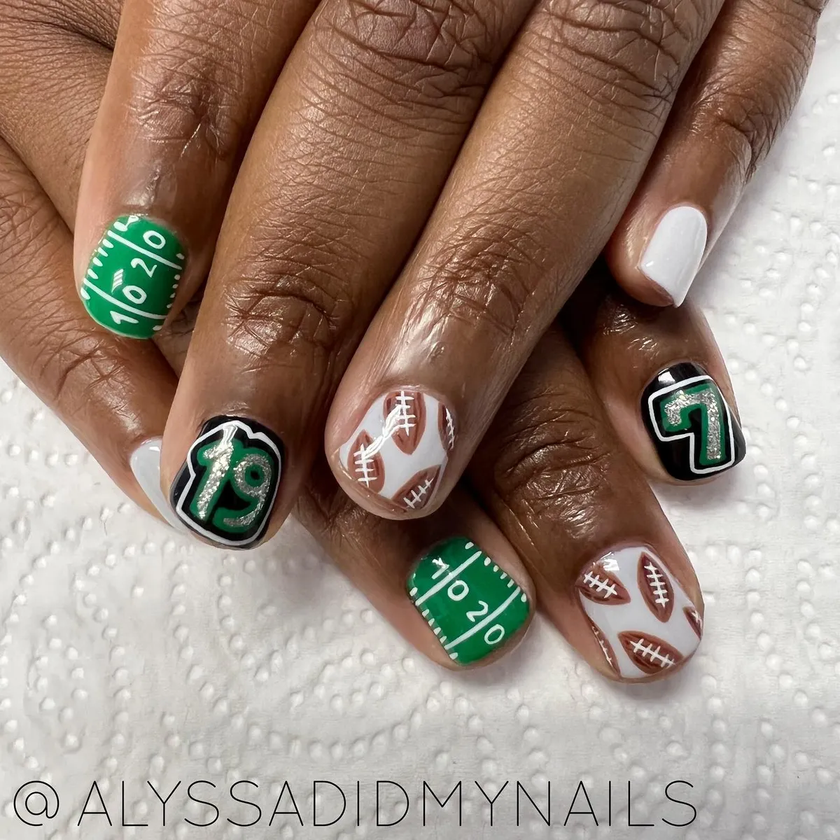 Green field numbers and bold jersey-style digits
