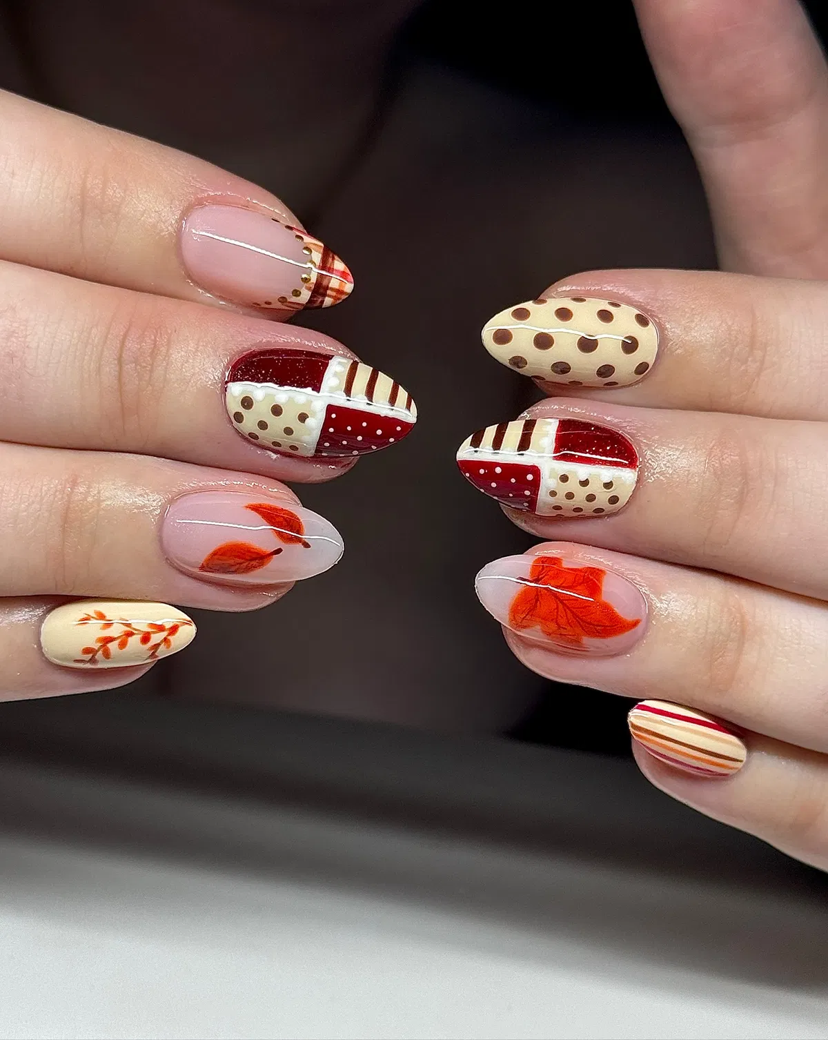 Patchwork patterns with polka dots and orange leaf accents