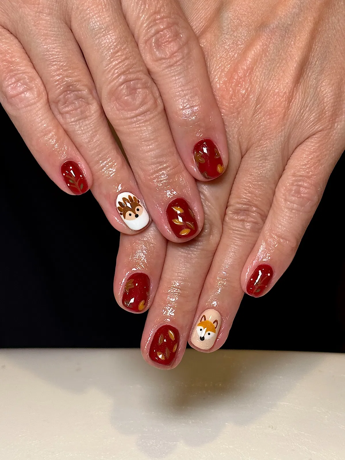Deep red set with gold leaf details and animal-face accents
