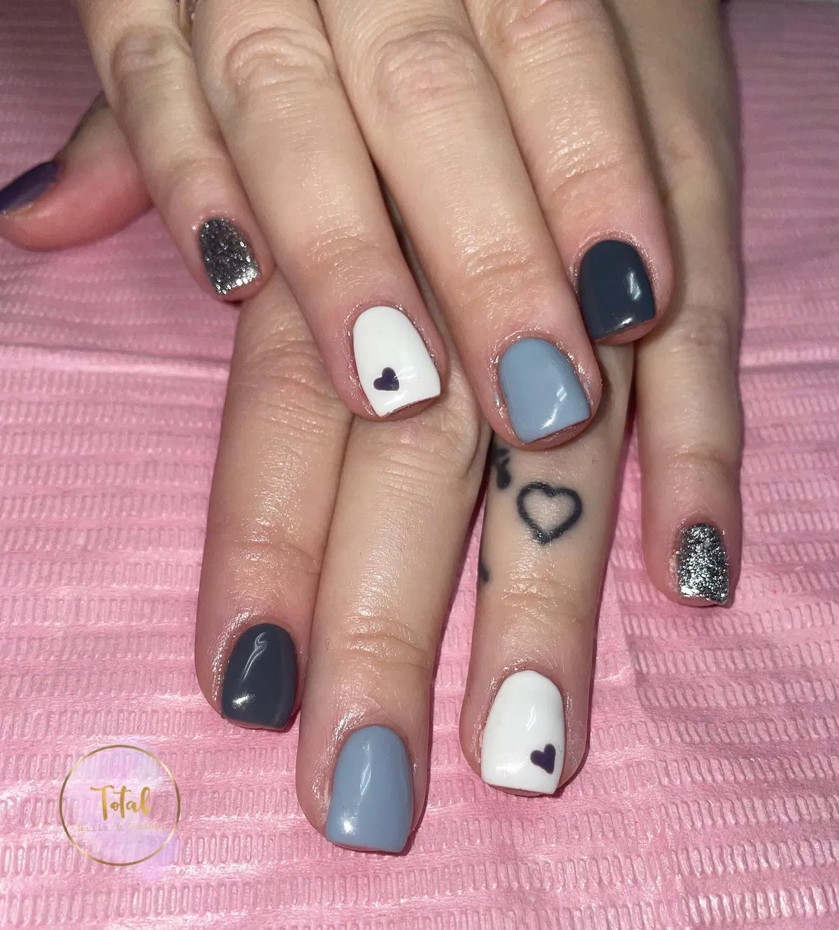Gray-blue and white color block with heart accents and silver glitter
