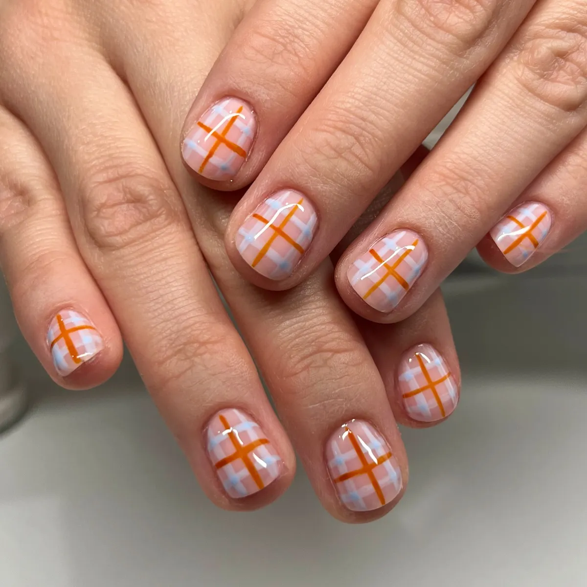 Pale pink and light blue check with orange plaid lines
