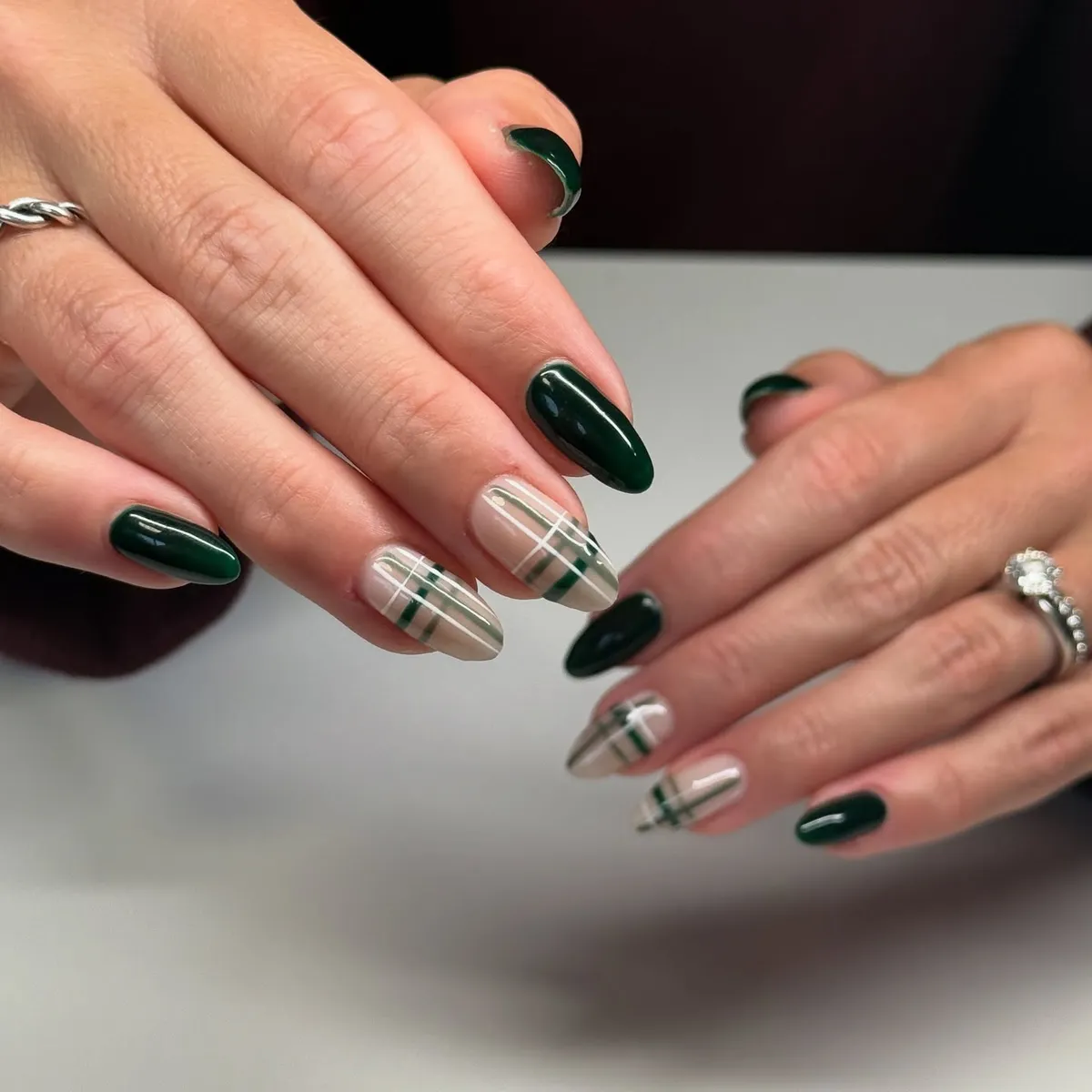 Dark green solids with nude-and-green plaid accents