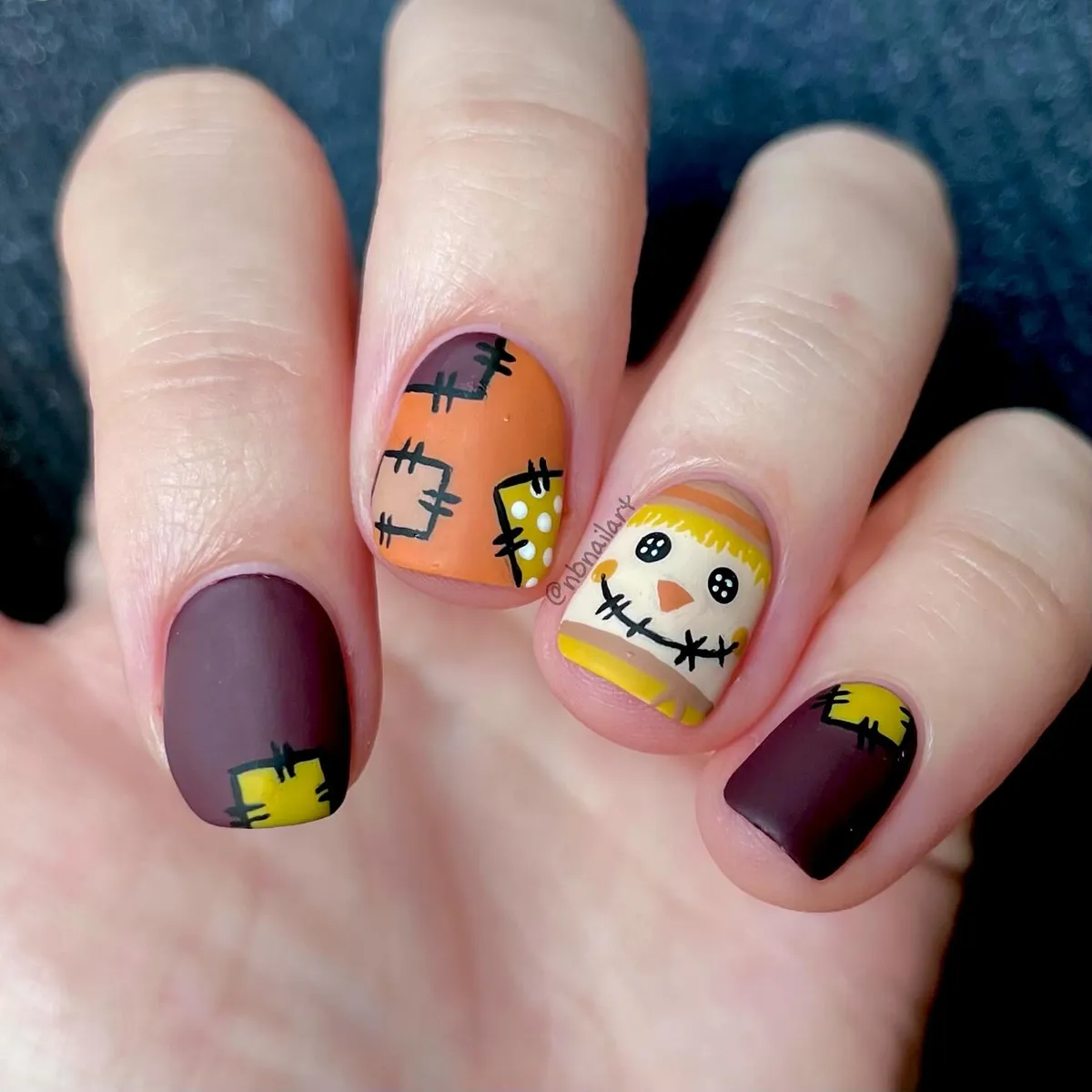 Matte patchwork and stitched face nail art