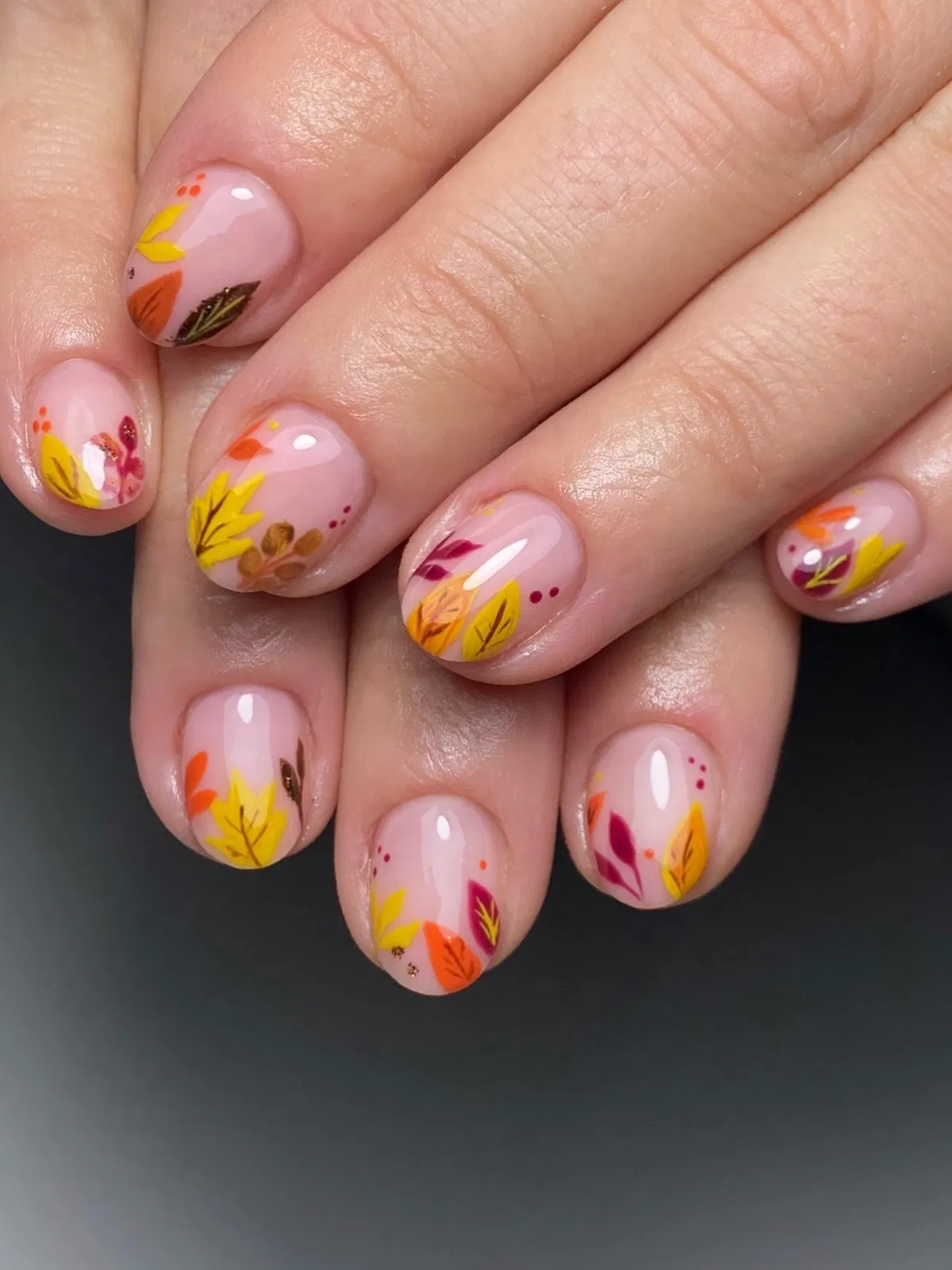 Pink base with multicolor leaf motifs