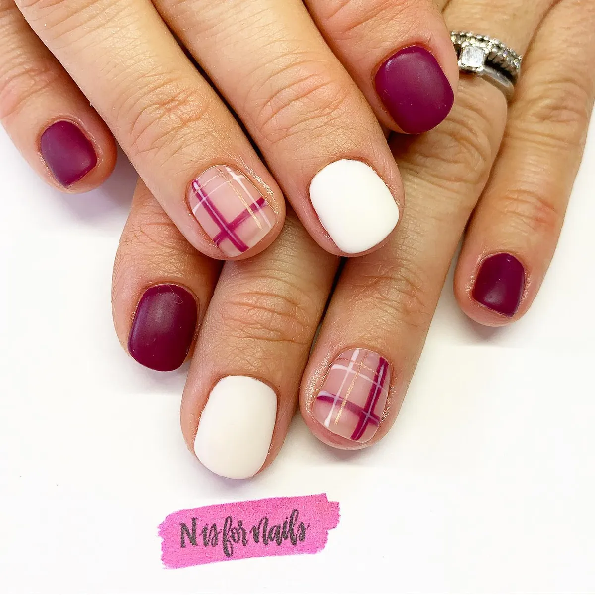 Matte purple and white with plaid accent nails