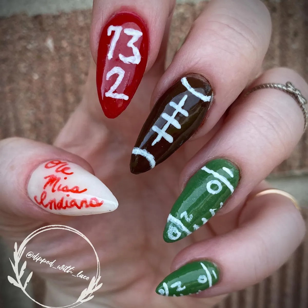 Red, green, and brown football-themed stiletto set with numbers and text