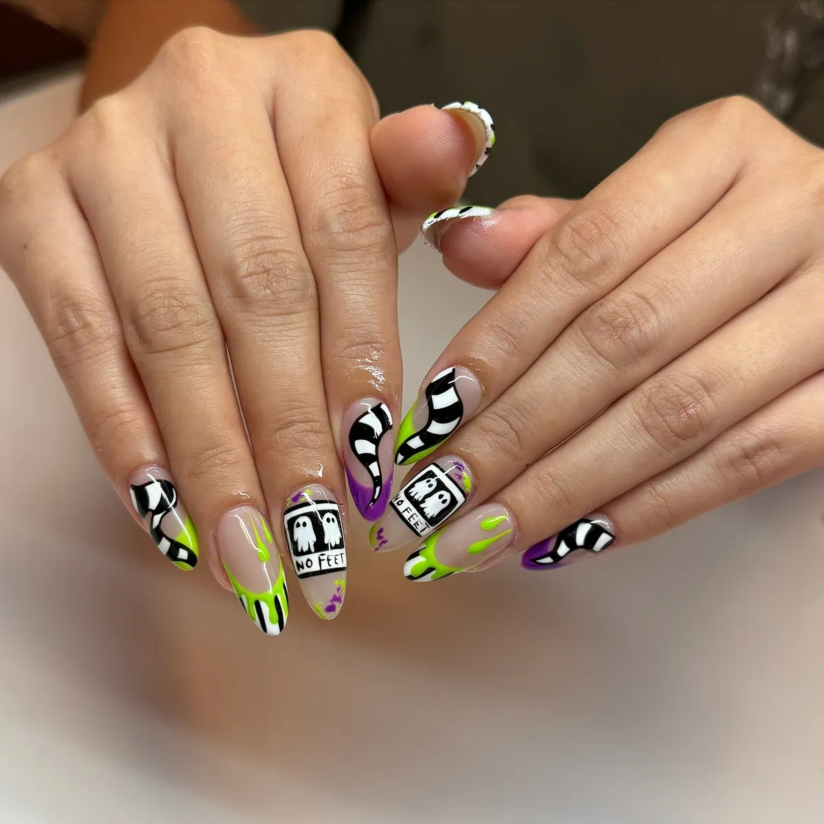 Wavy stripes with neon accents and โNO FEETโ ghost panels