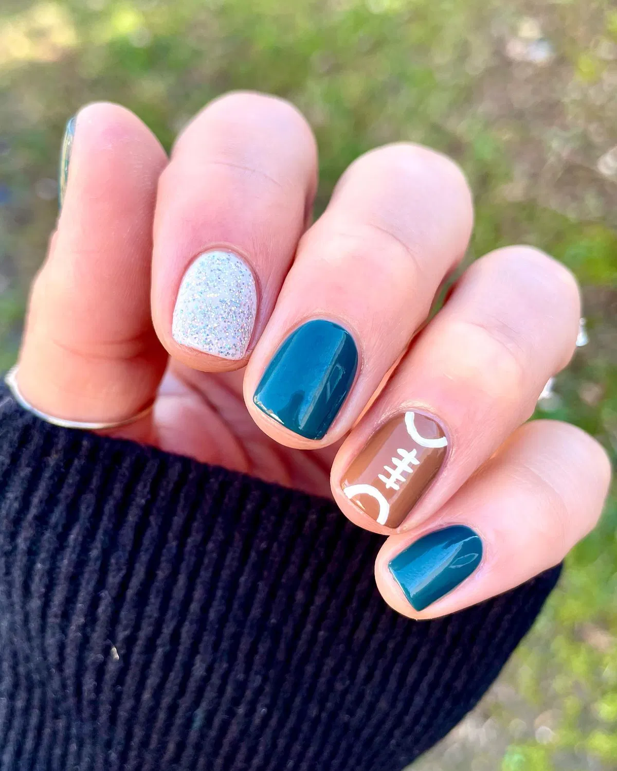 Teal and silver with a single football accent nail