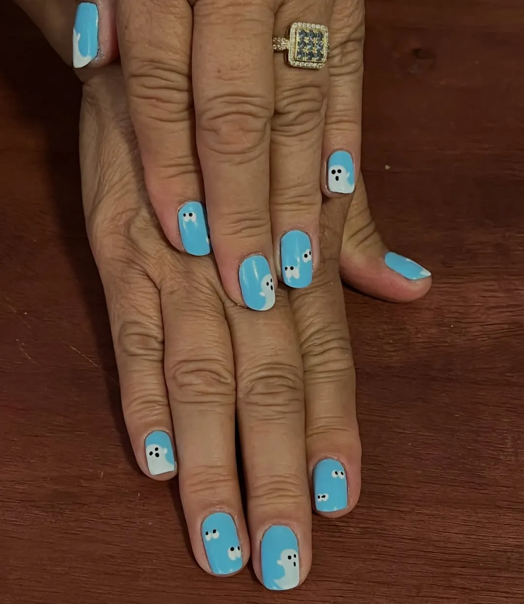 Minimal light-blue nails with corner ghosts