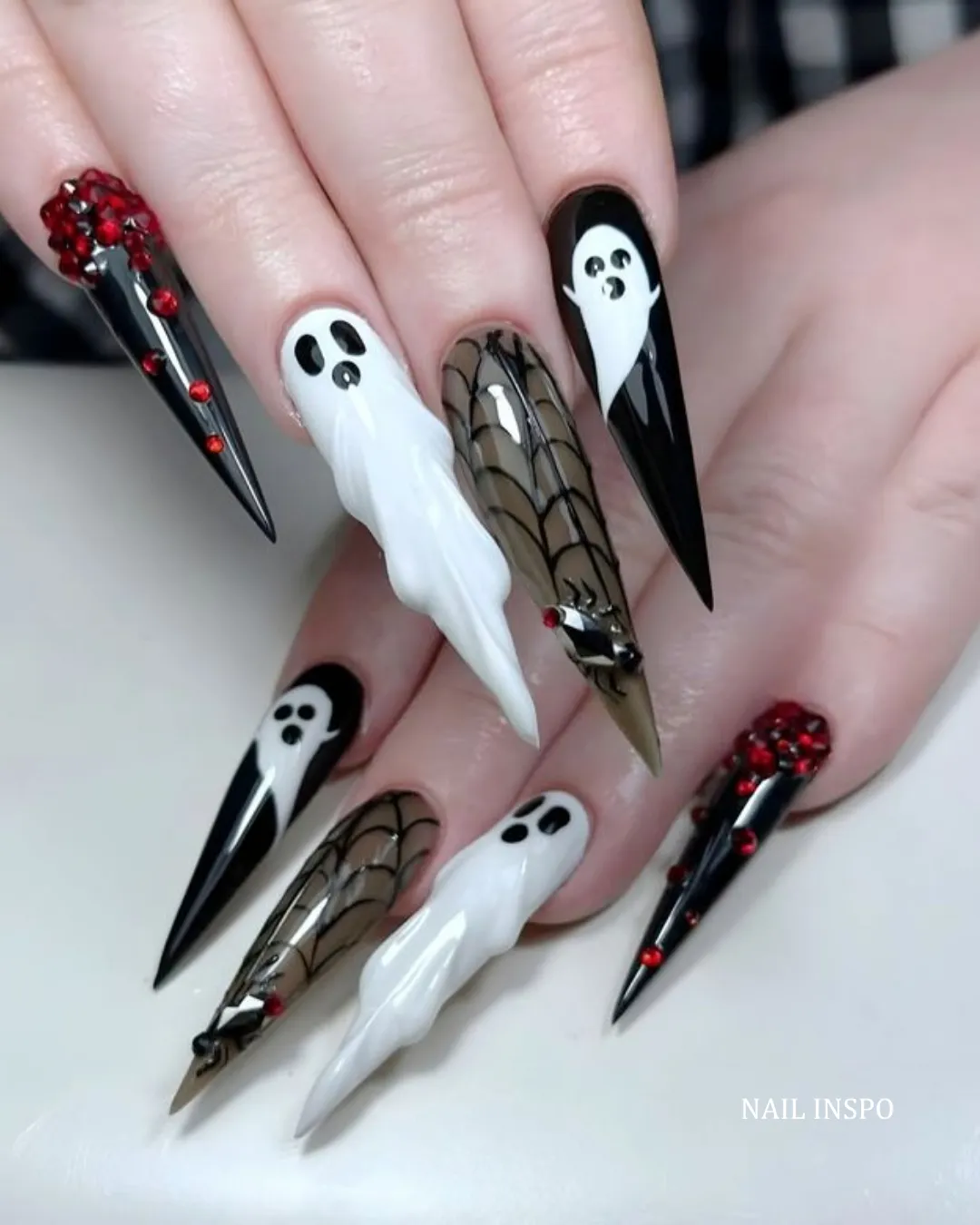 Extra-long stiletto ghosts with webs and red embellishments